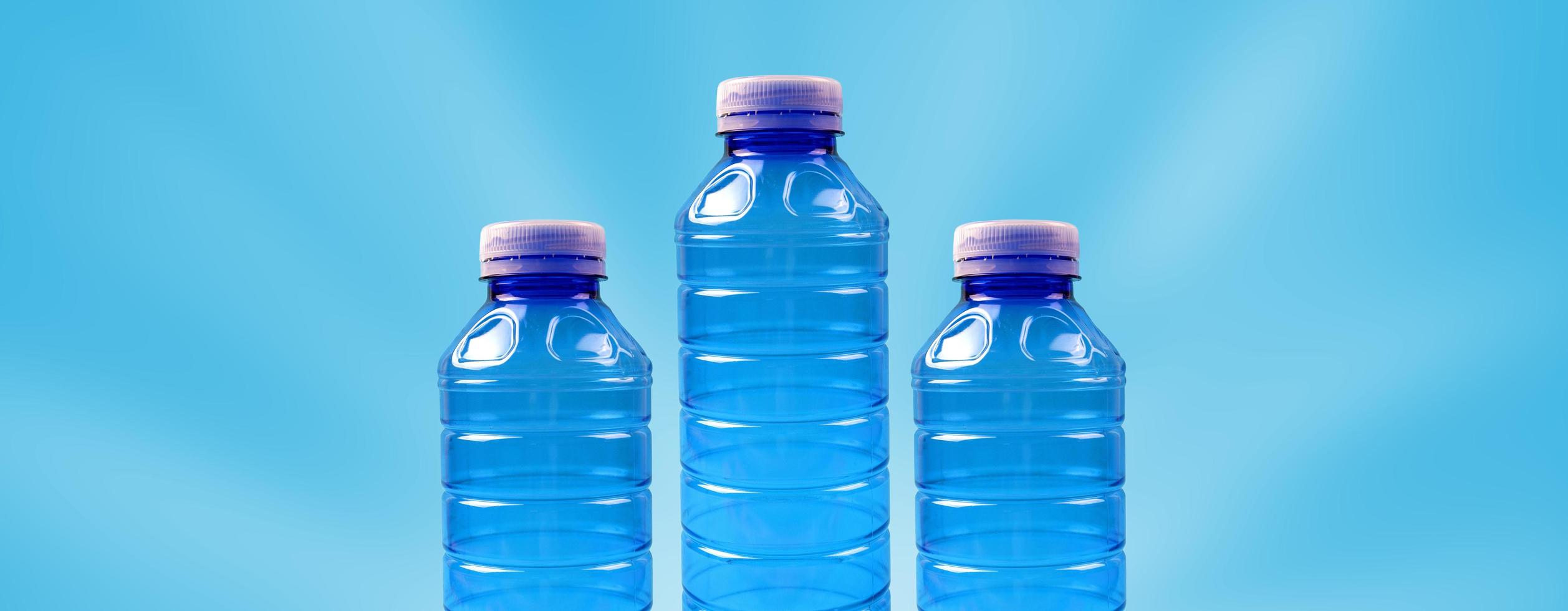 Eco banner. Concept of environmental protection and segregation of plastic waste. Plastic bottles on a blue background. photo