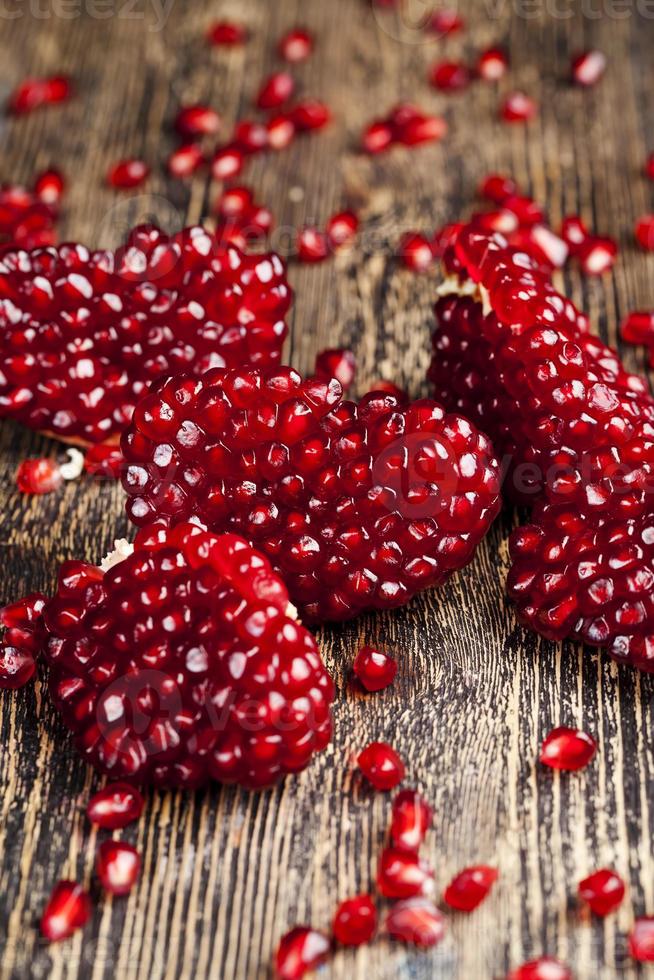 red delicious grains of ripe pomegranate, sweet and sour taste photo