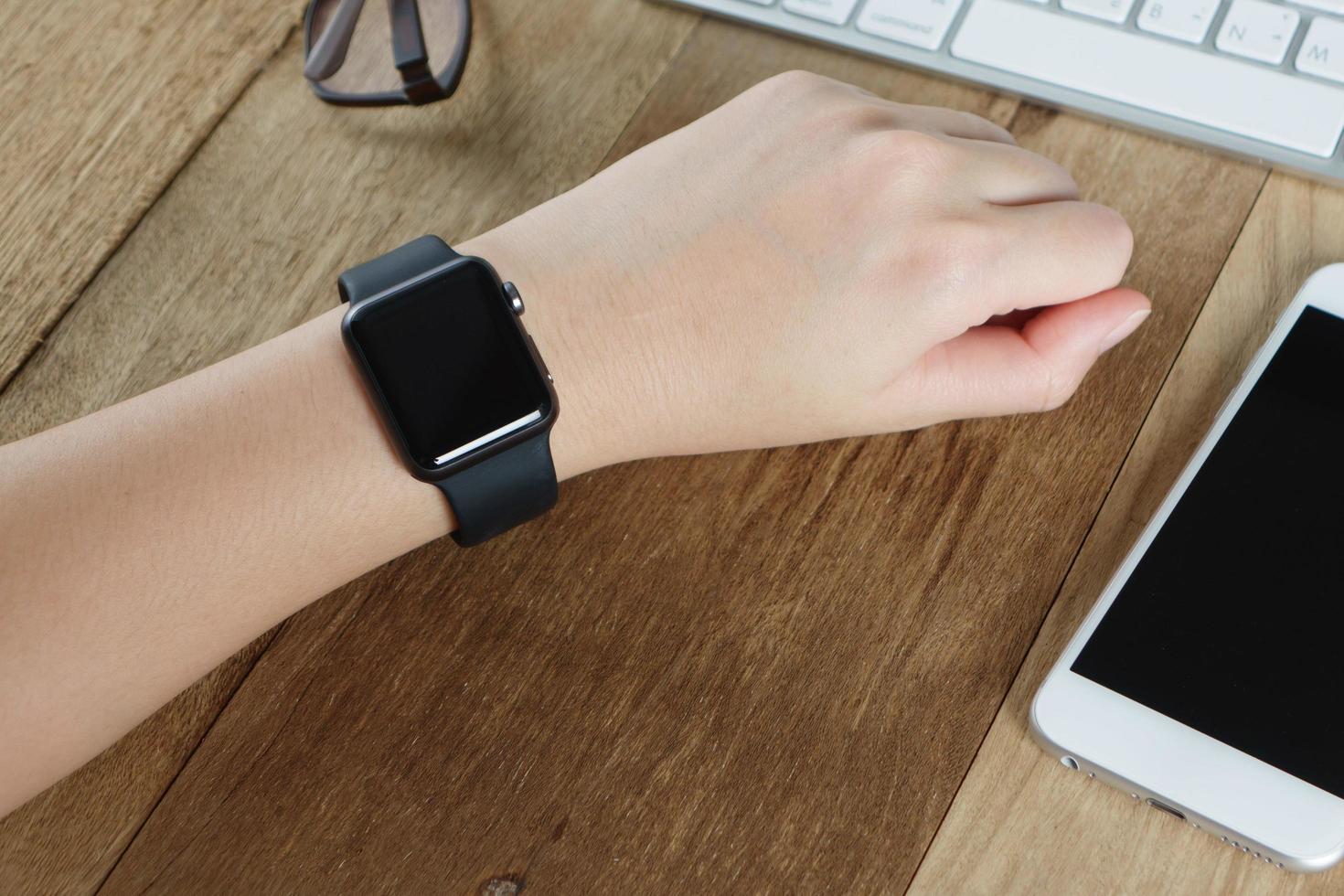 woman hand wearing elegant smartwatch photo