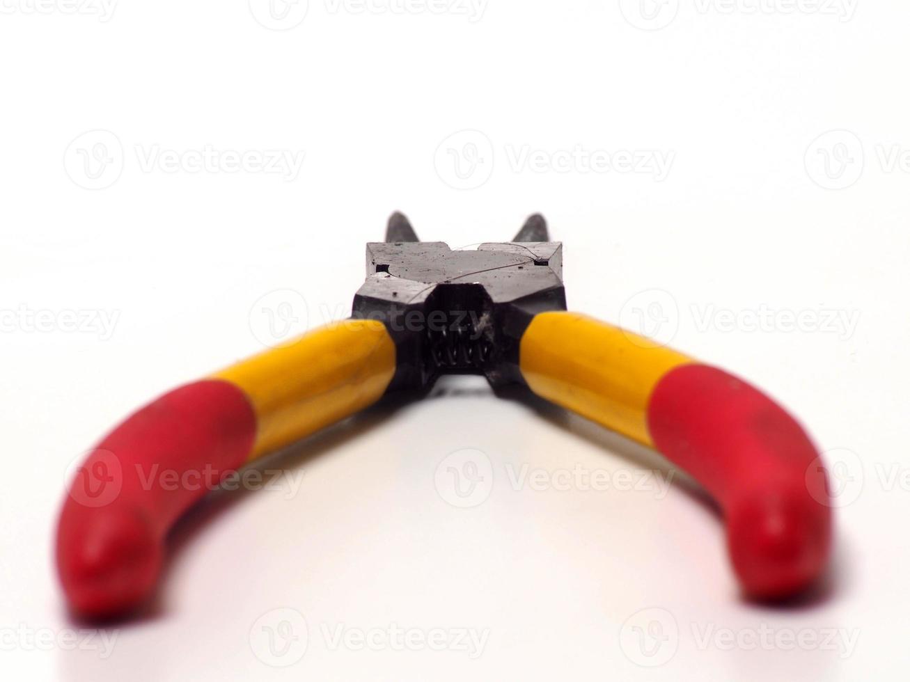 Picture of snap ring plier that has a yellow - red handle photo