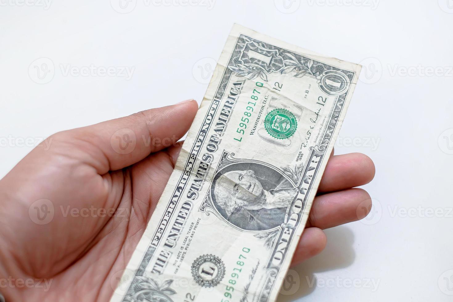 a-man-holding-a-dollar-bill-in-his-hand-with-a-one-dollar-bill