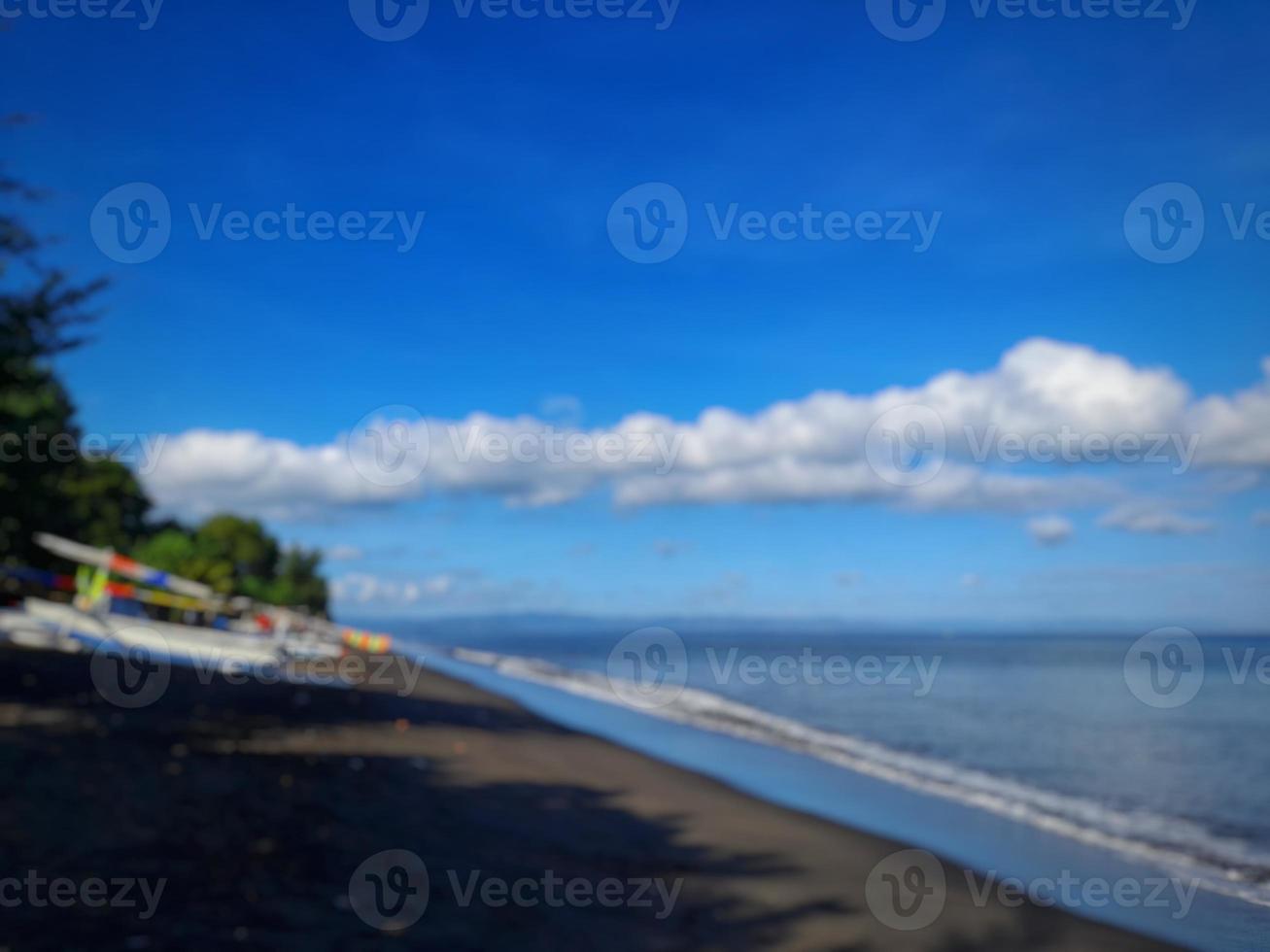 abstract blur background of beach with bright blue sky photo