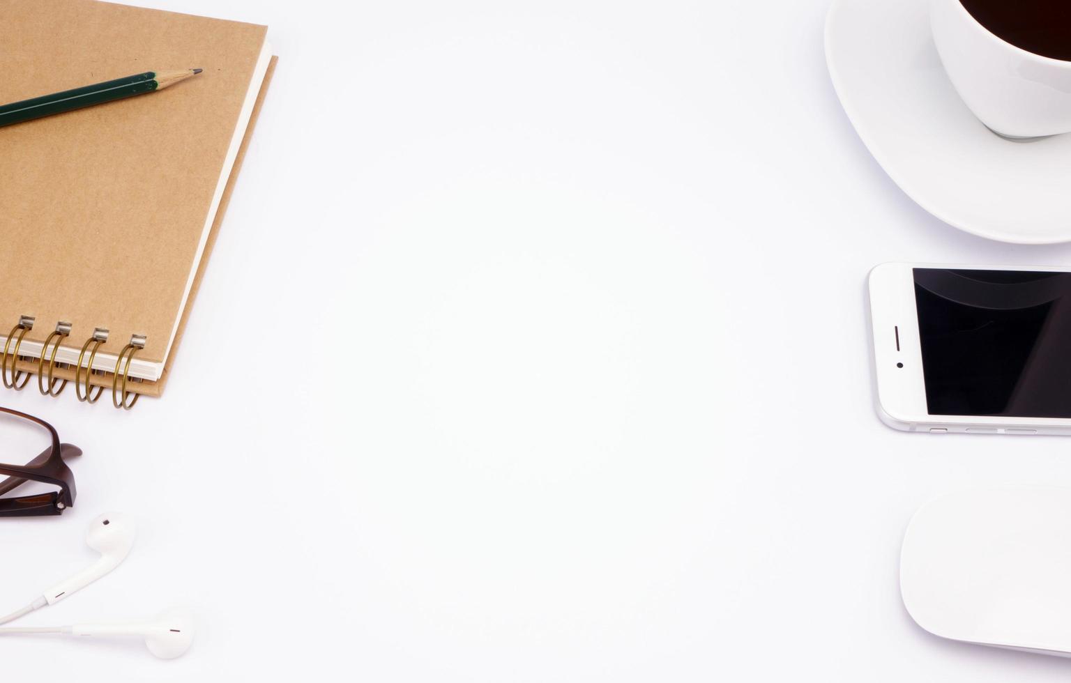 Business work place with cup of coffee on white table photo