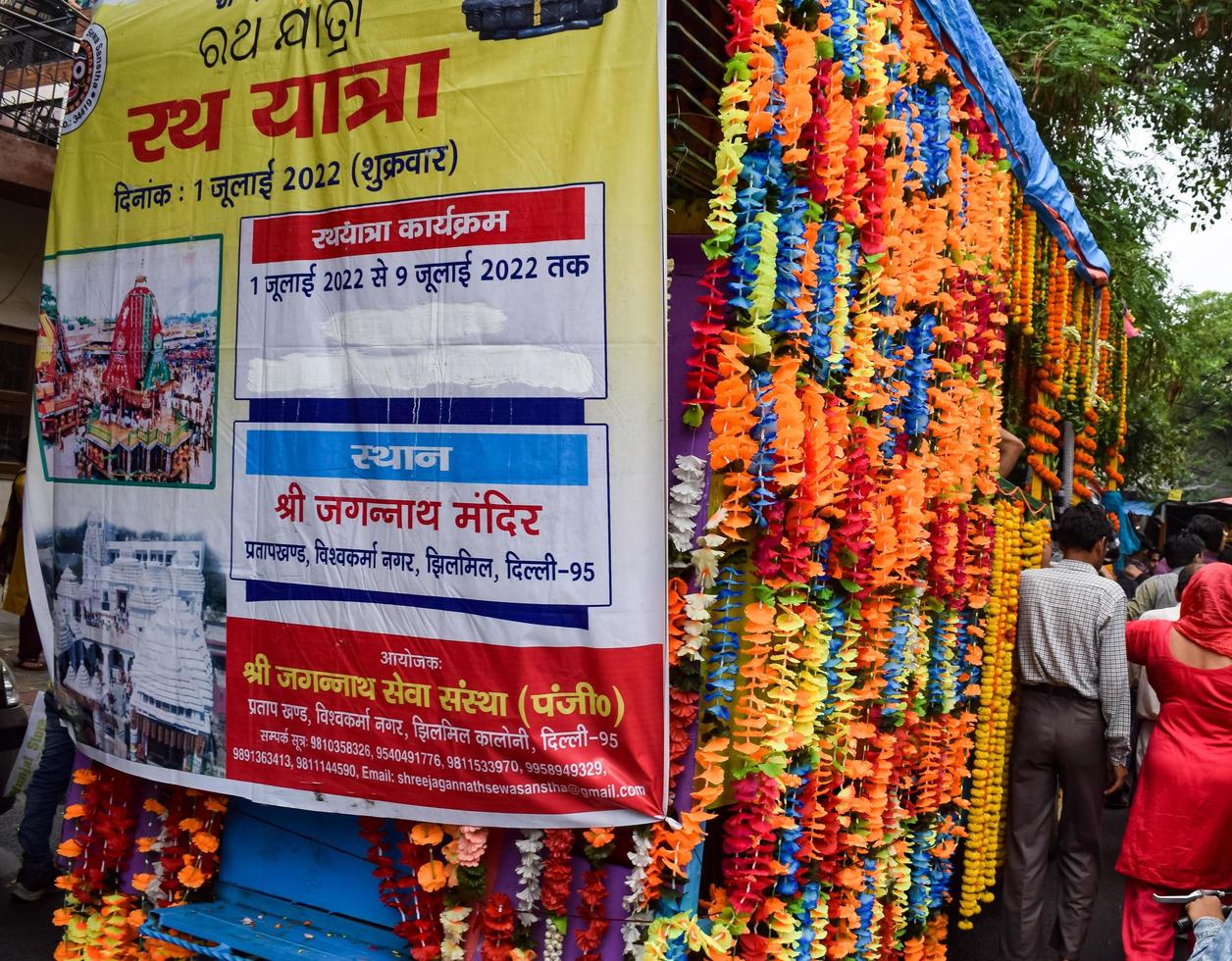 New Delhi, India July 01 2022 - A huge gathering of devotees from different parts of Delhi on the occasion of ratha yatra or rathyatra. Rath for Lord Jagannath pulled by people, Jagannath Rath Yatra photo