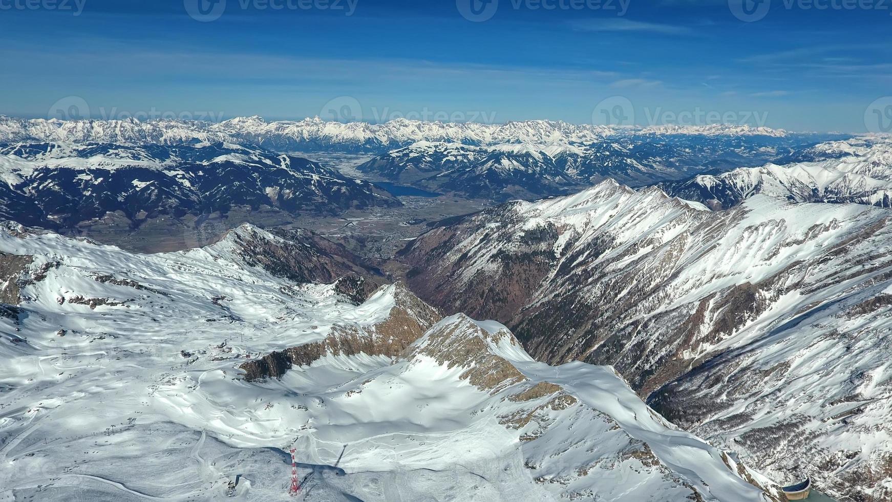 Amazing view from a drone over the snowy mountain hills photo