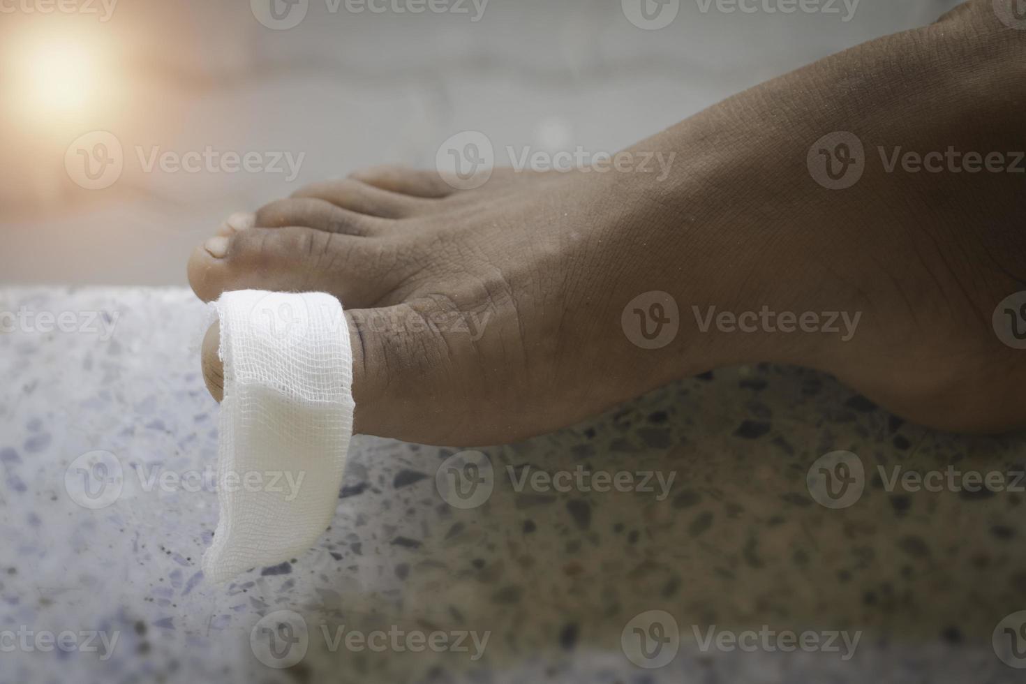 Asian child feet with an adhesive. Foot first aid, plaster.photo Hospital and first aid concept photo