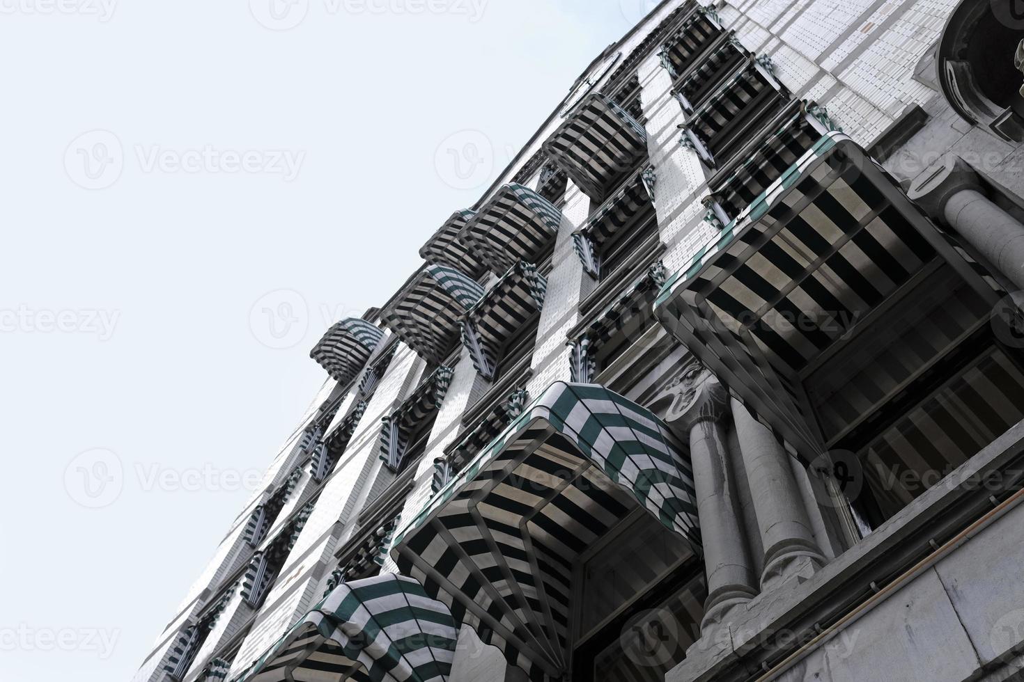 Interesting pattern of windows and blinds on a building exterior in Rotterdam photo