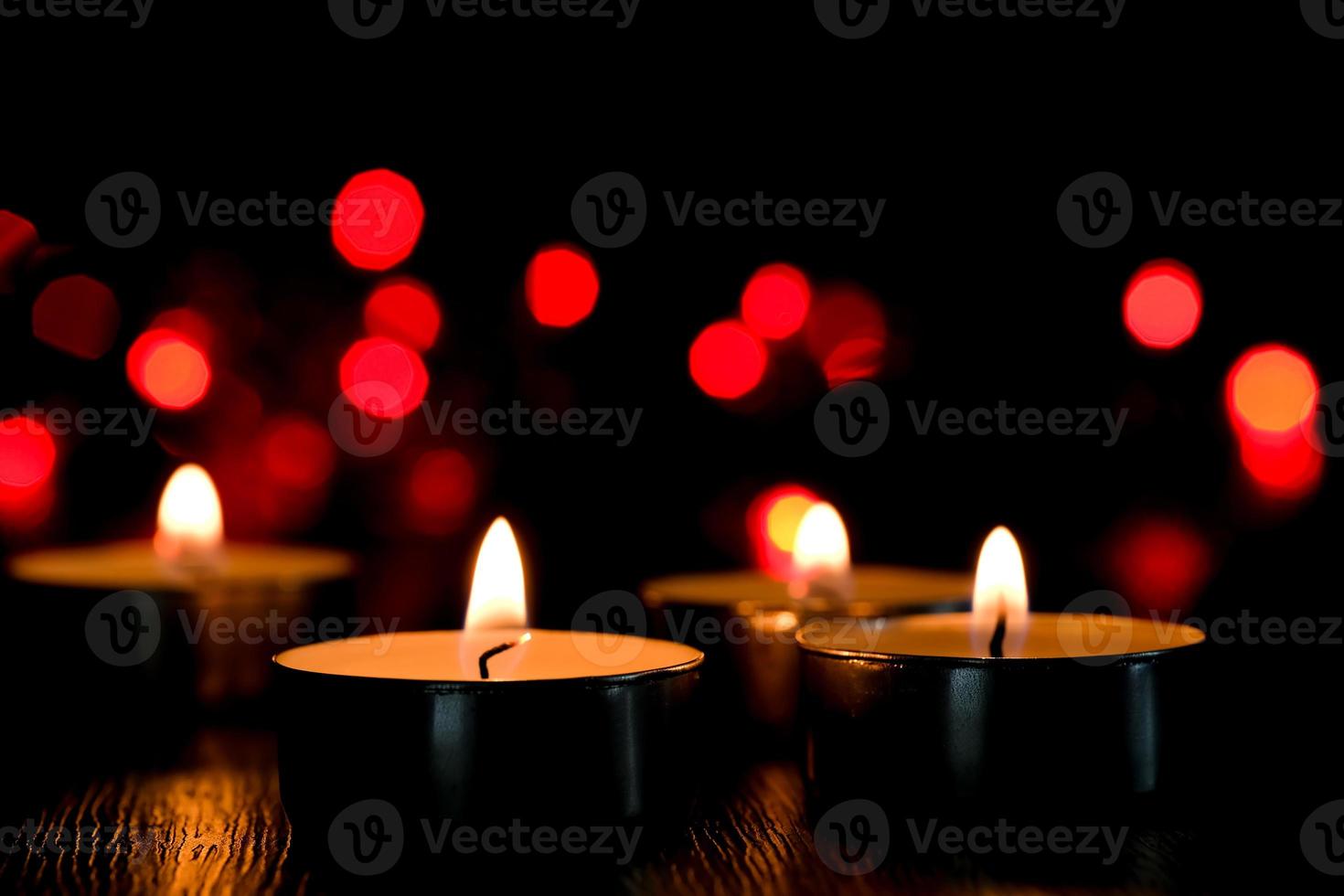 Candle light and bokeh background in the darkness with space for text or image. photo