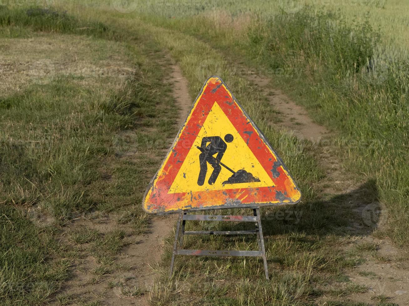 road working sign on country road photo