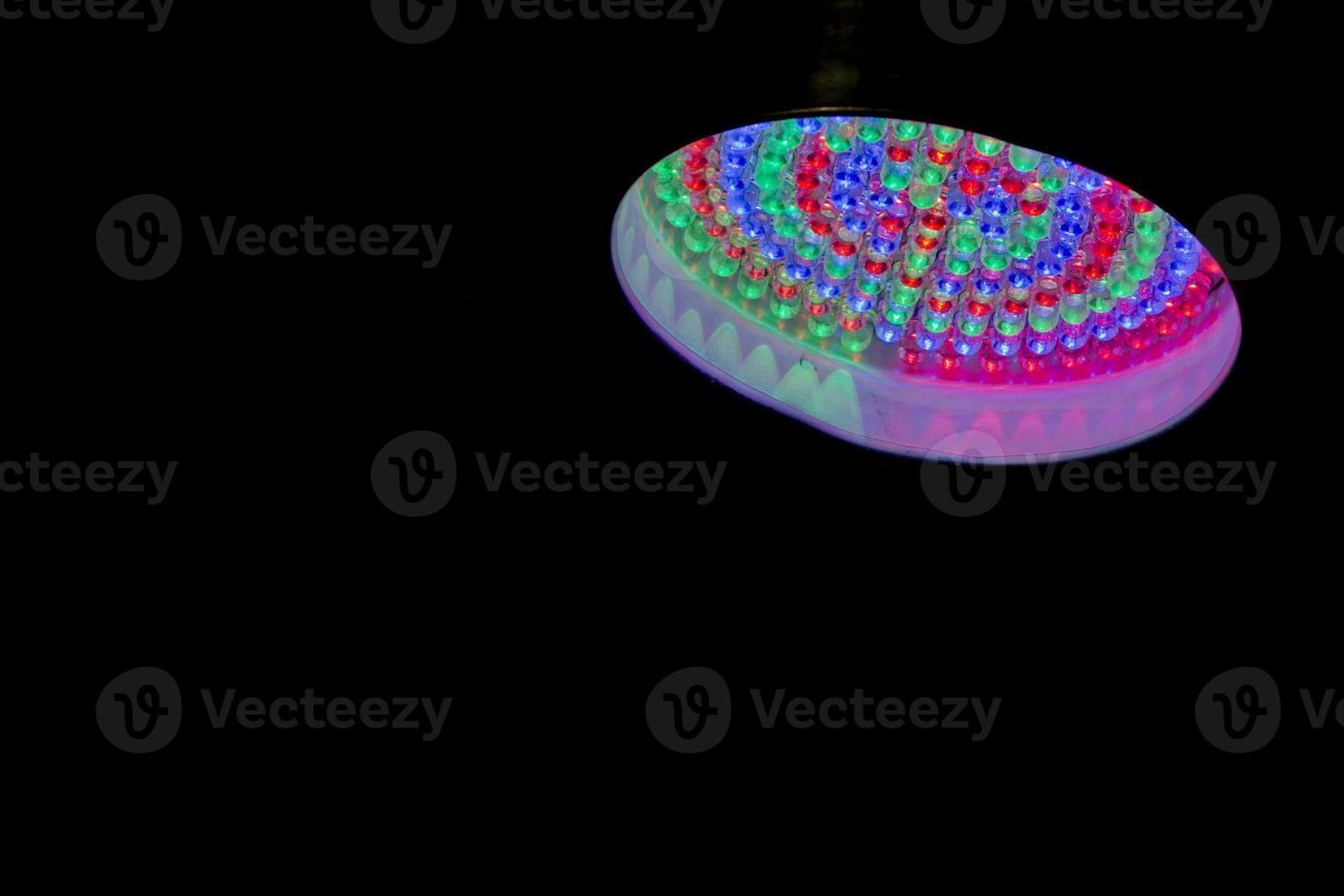 multi color led lamp on black background photo