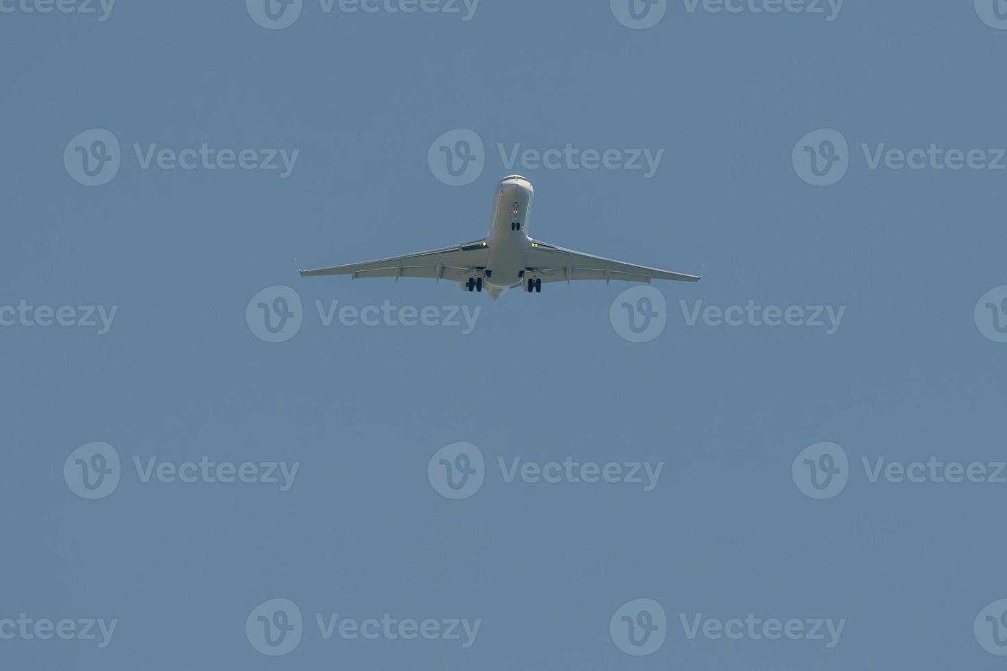 airplane jet while landing from bottom photo