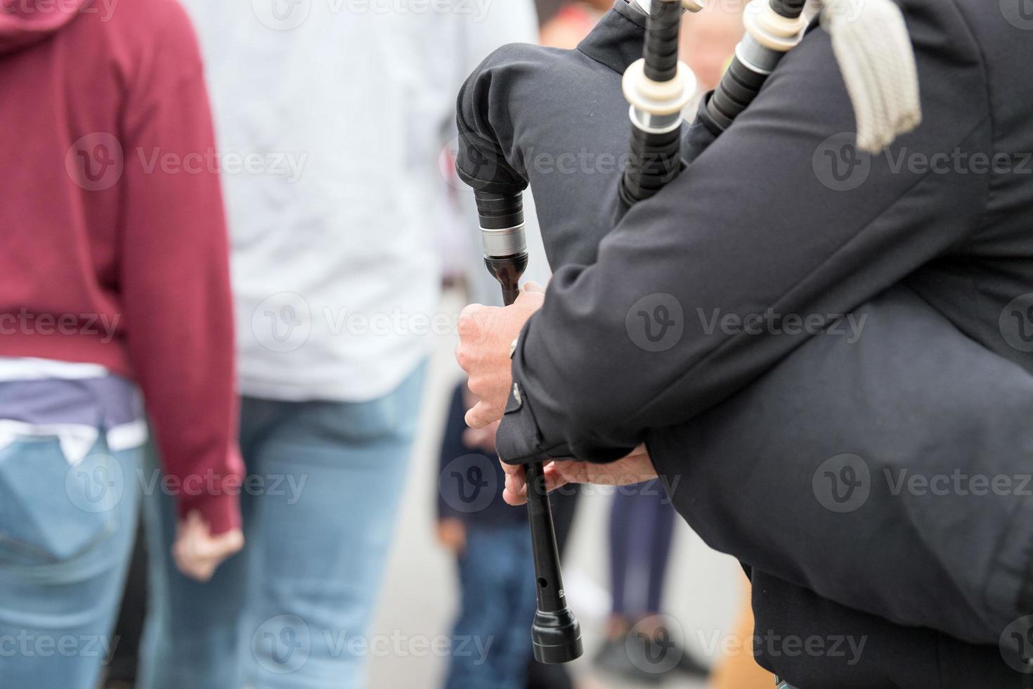 Man playing cornamuse on London Bridge photo