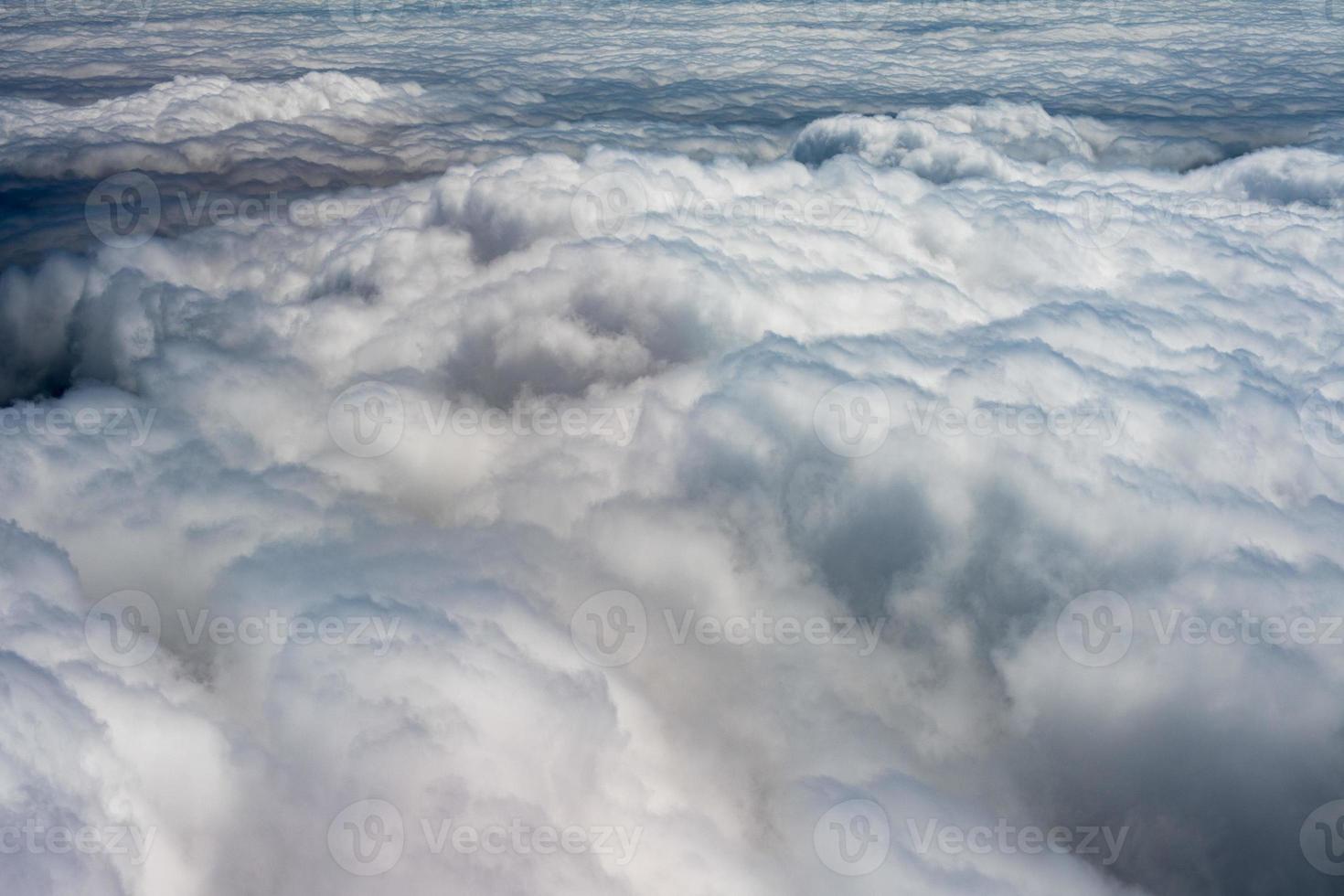 clouds in the sky from airplane window photo