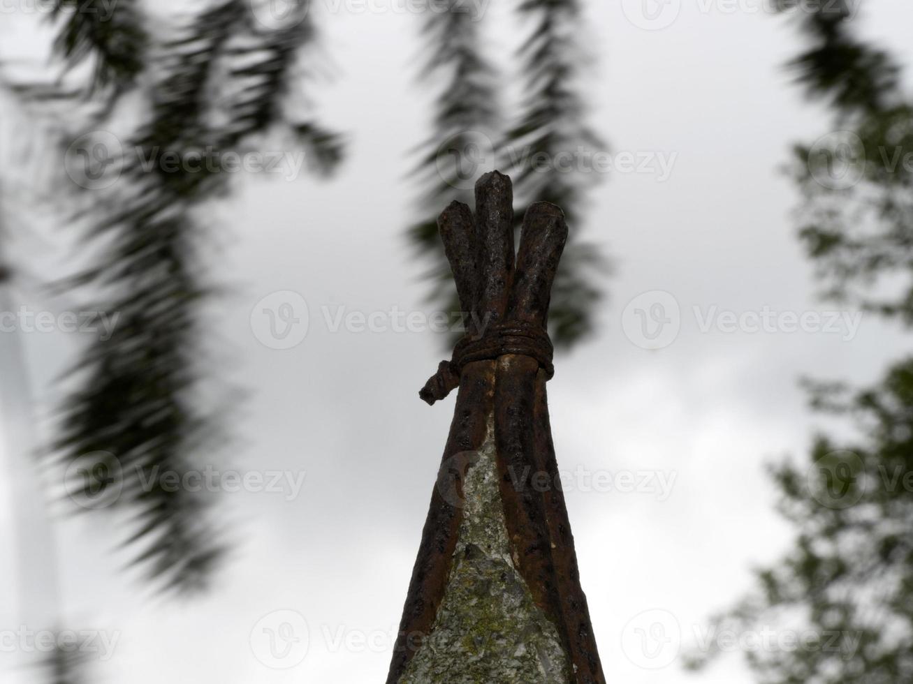 rusted iron bars crossed and tied up photo