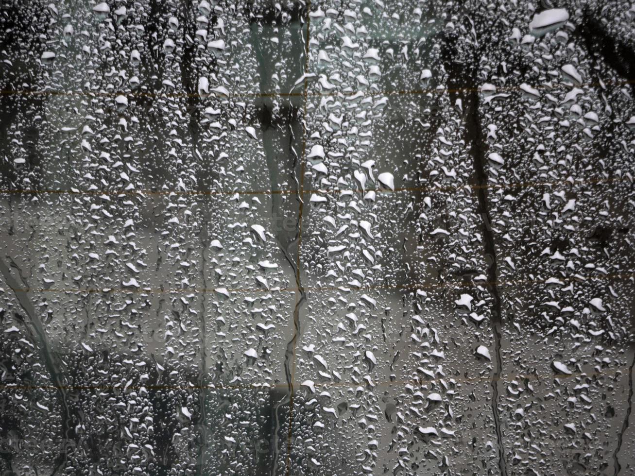 rain drops on blue metal close up macro photo