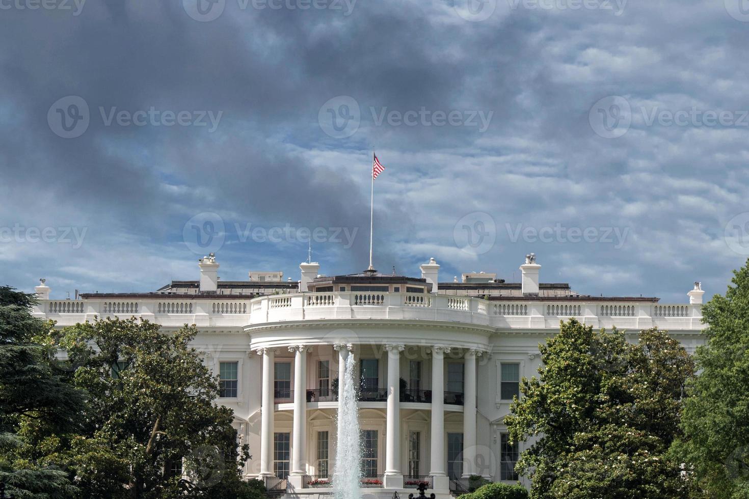 White House building in Washington DC on cloudy day photo