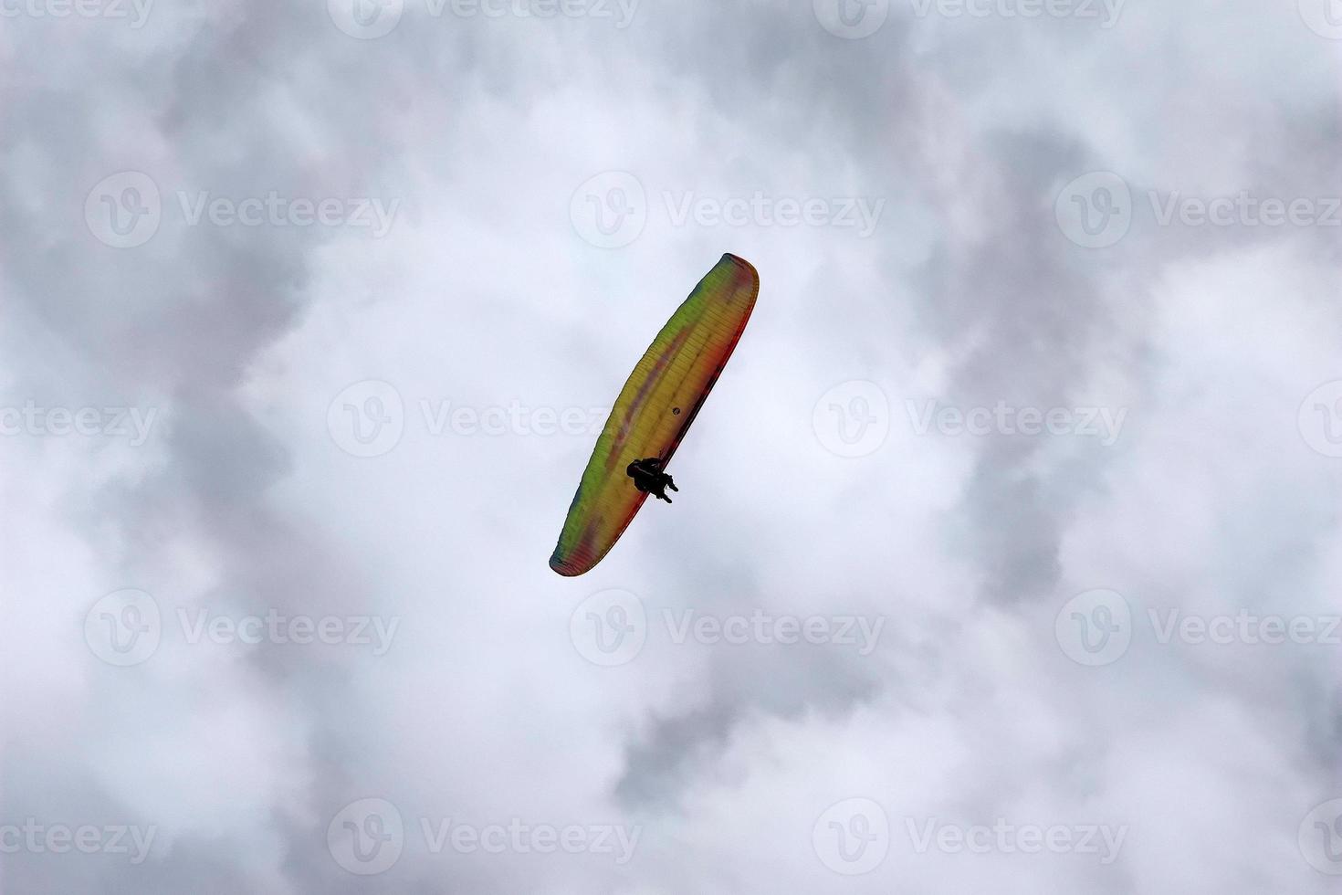 paraglider on cloudy sky photo