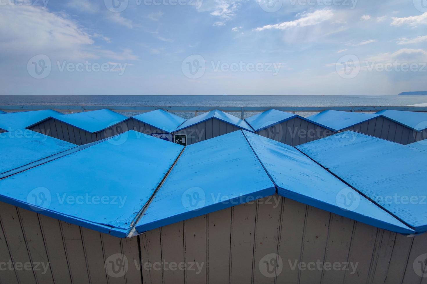 Bathhouse beach club preparation set up for summer season in Italy photo