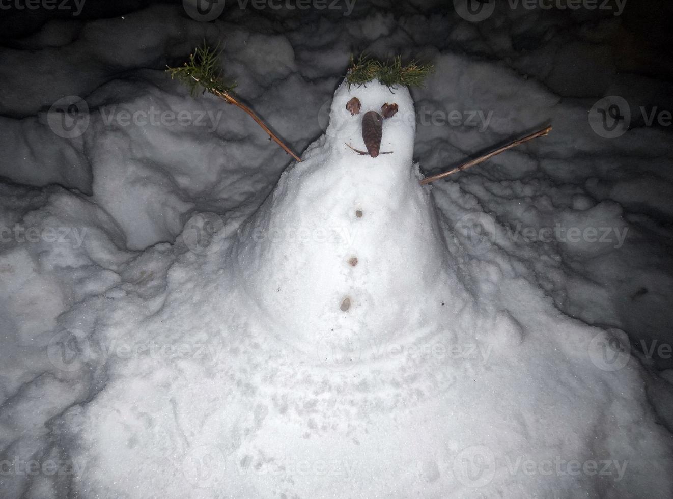 Snow man snow man hand made at night photo