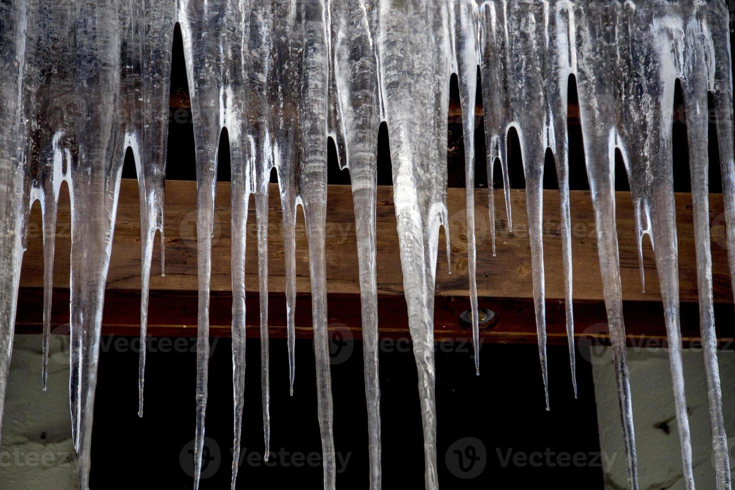 icicles on house in winter photo