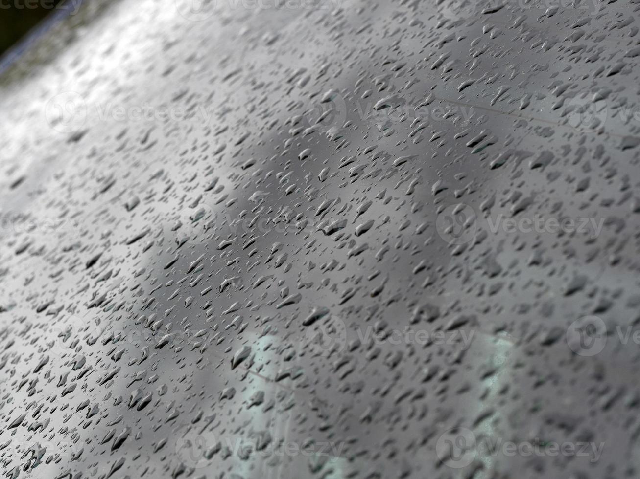 rain water drops on car glass window photo