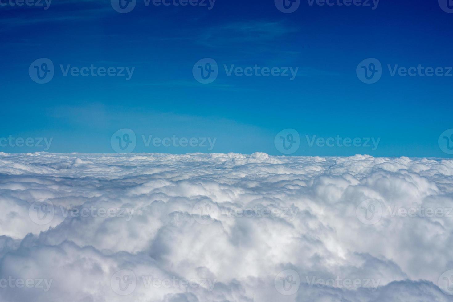 clouds in the sky from airplane window photo