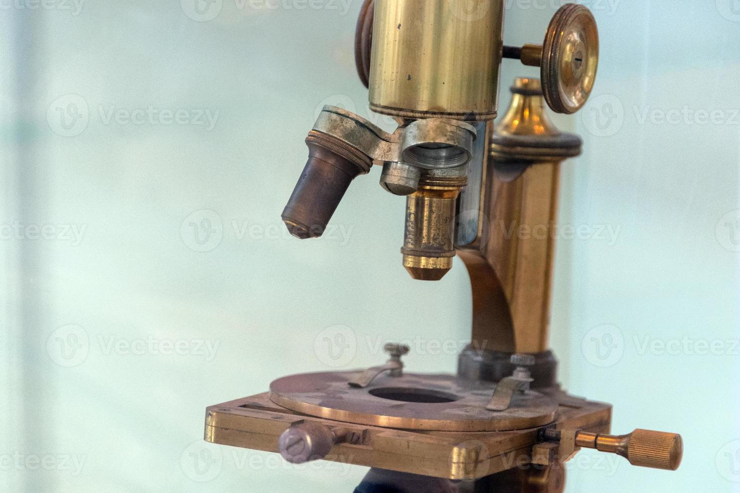 Old ancient microscope detail close up photo