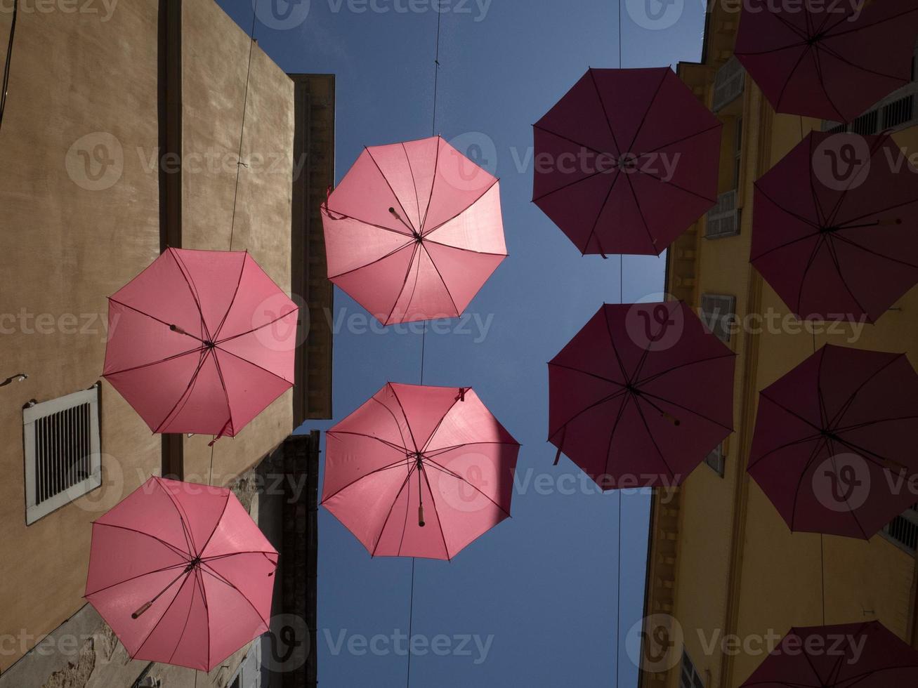 Grasse France pink umbrellas street photo