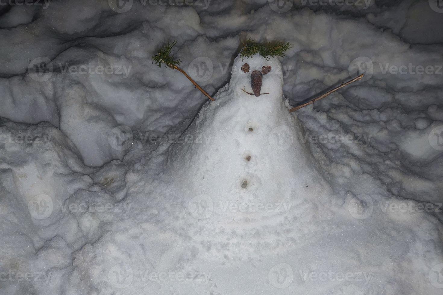 Snow man snow man hand made at night photo