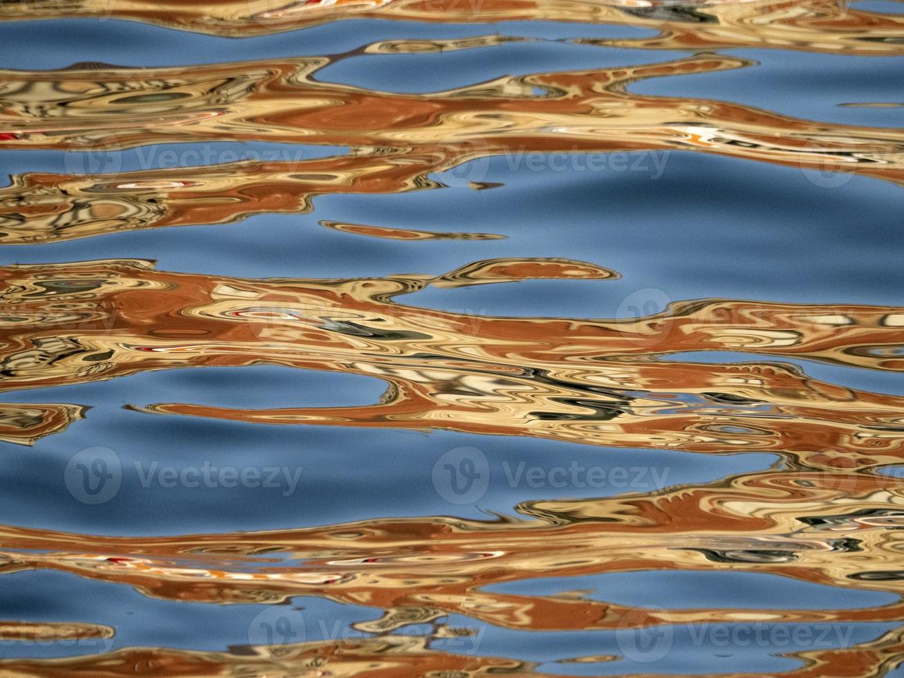 orange reflections on the blue sea like painting photo