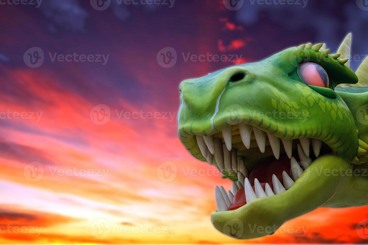 green dragon on red sky photo
