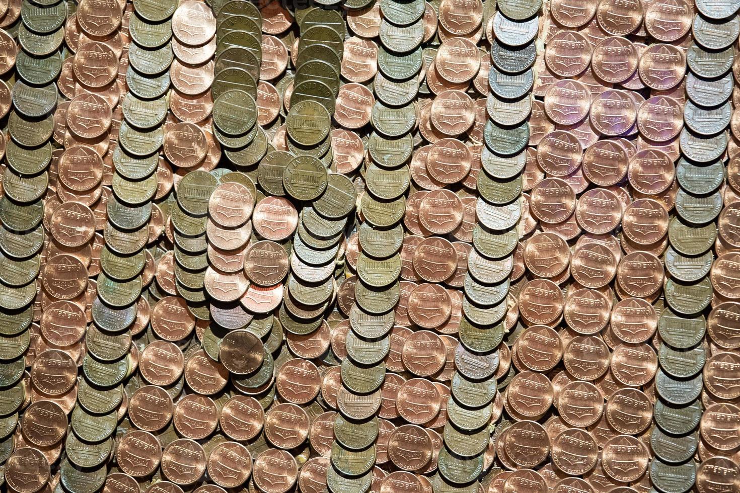 hundreds of one penny coins detail photo