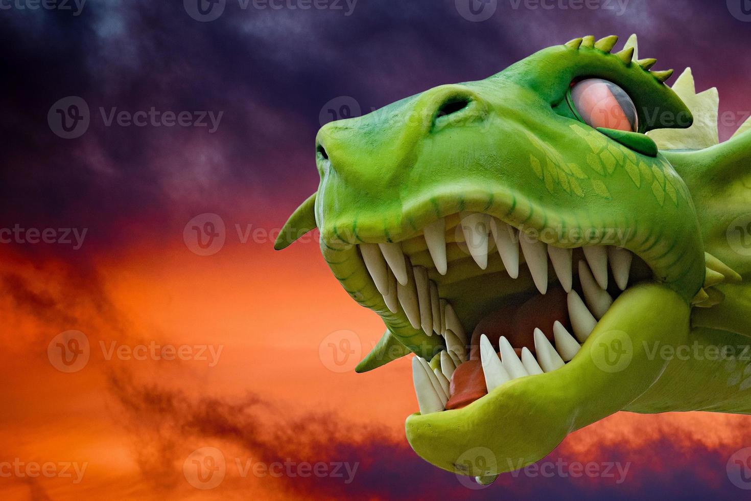 green dragon on red sky photo