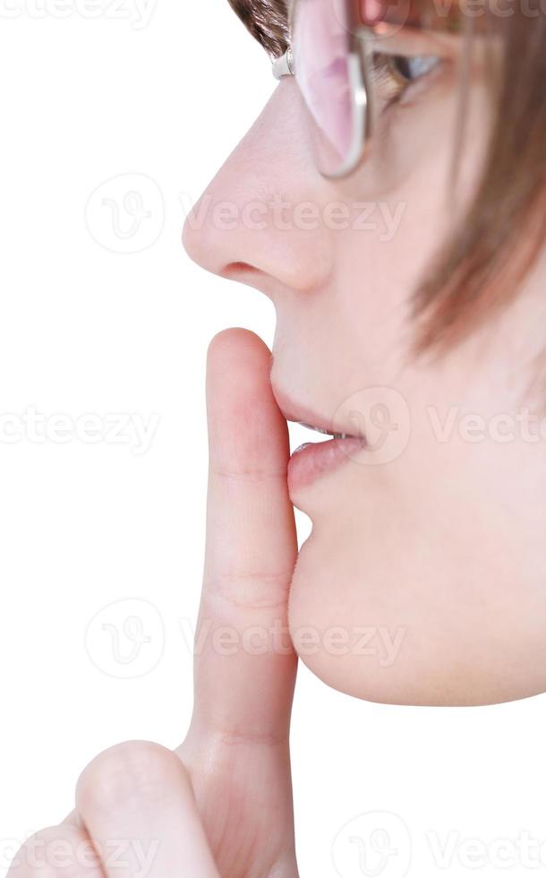 finger near lips close up - silence hand gesture photo