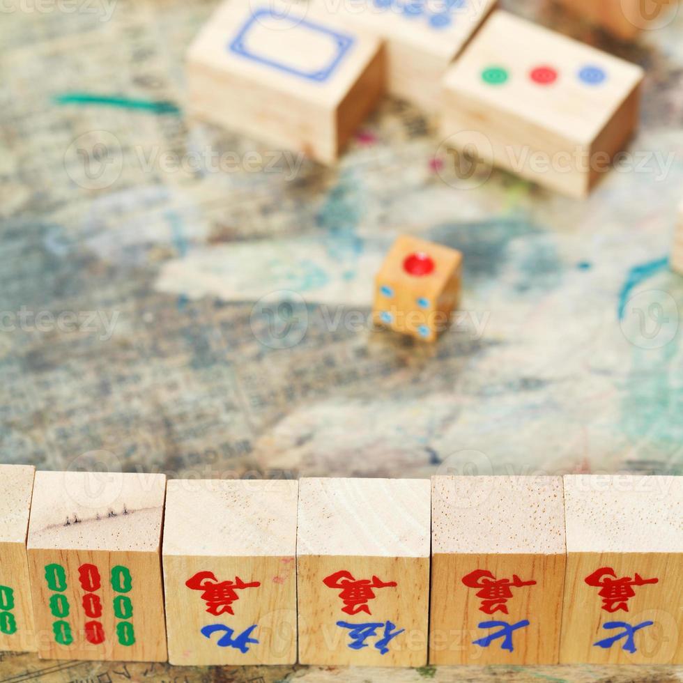 mahjong wood tiles close up and playing field photo