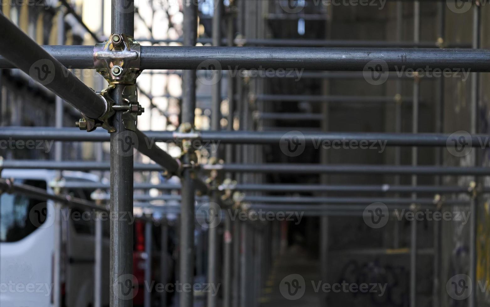 Construction to hold the scaffolding on a building in Naples, Italy photo