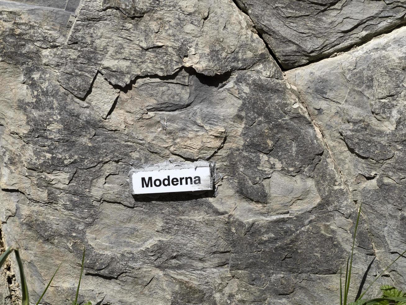 RECCO, ITALY - APRIL 26 2021 - Moderna Vaccine name on stone behind the church photo