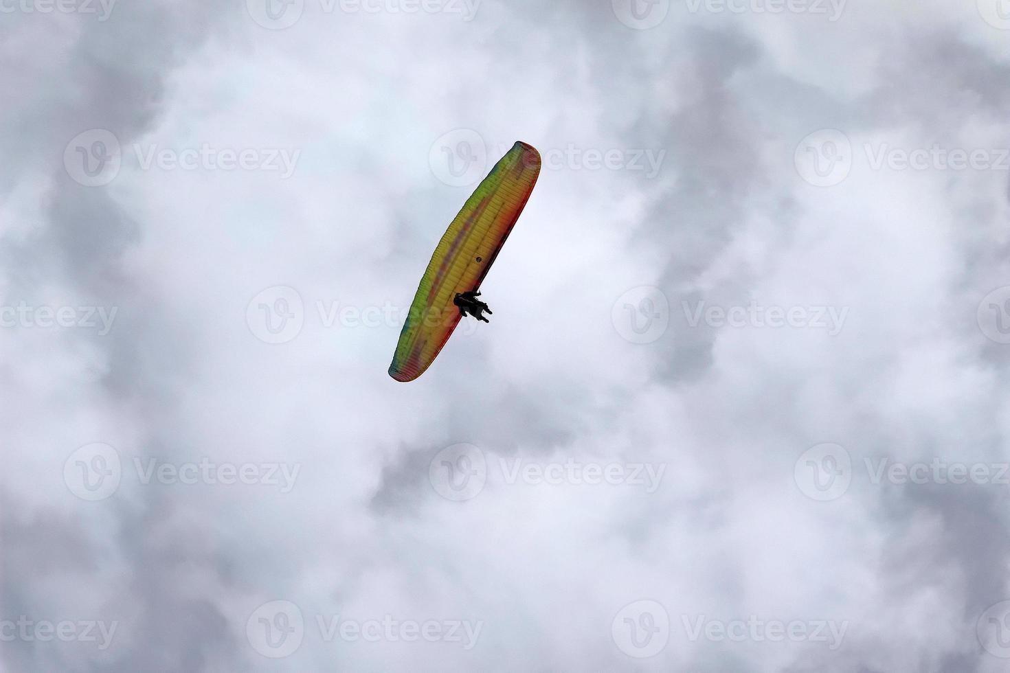paraglider on cloudy sky photo