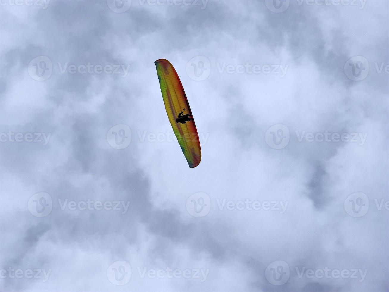 paraglider on cloudy sky photo