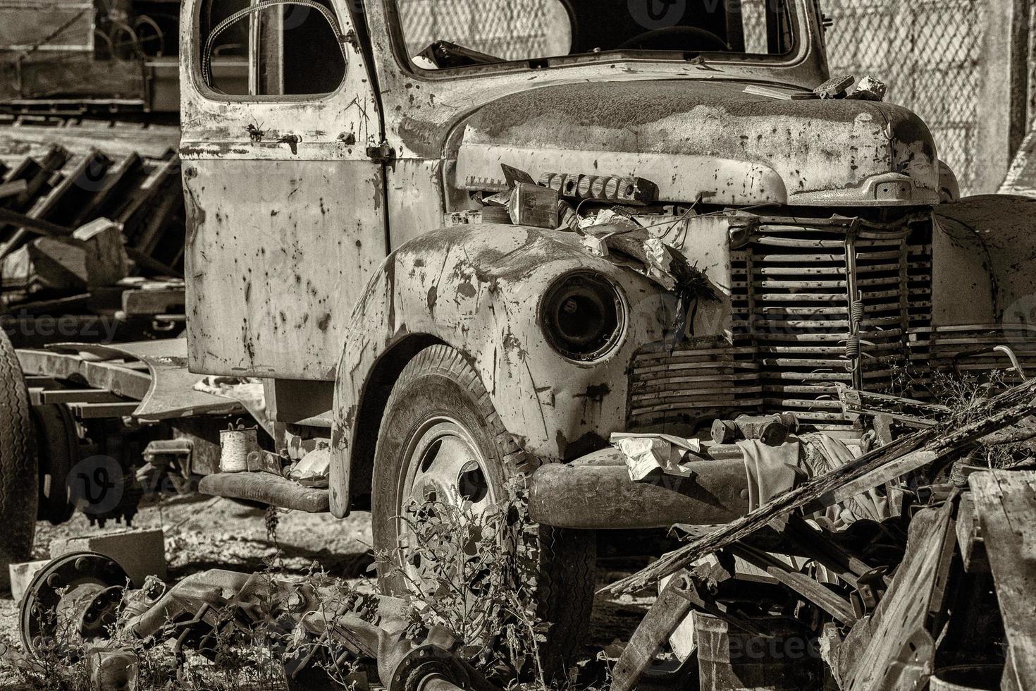 old abandoned rusted truck in b and w photo