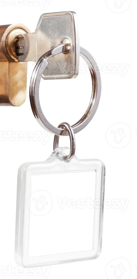 key with cut out square keychain in cylinder lock photo