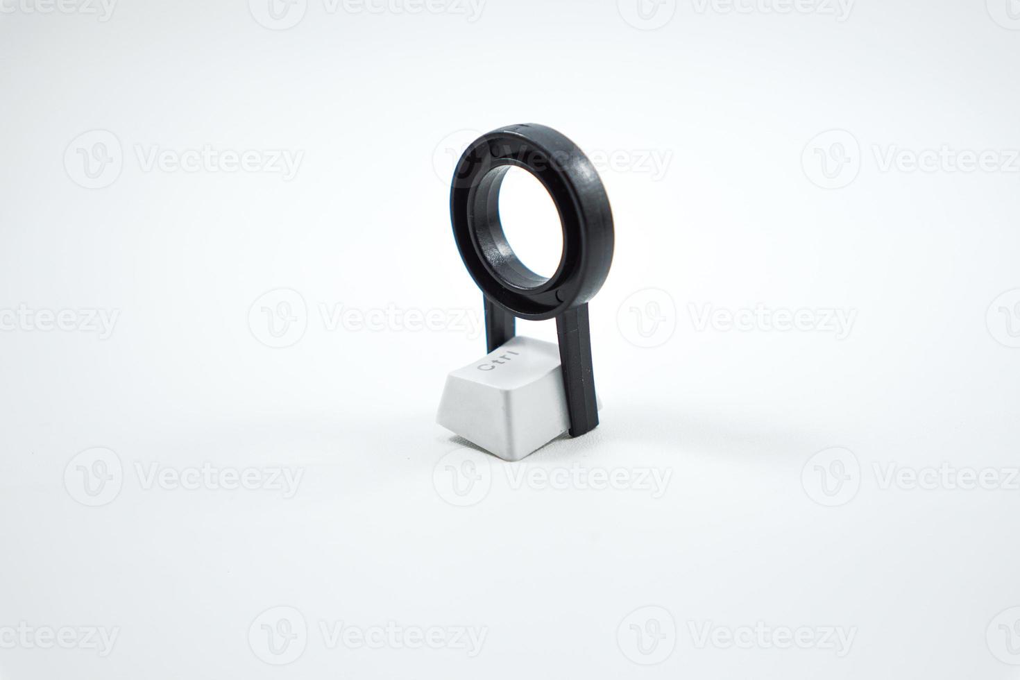 keycap puller with mechanical keyboard keycaps isolated on a white photo