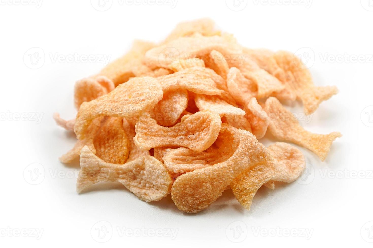 Fried prawn crackers or shrimp crackers in the shape of red fish photo