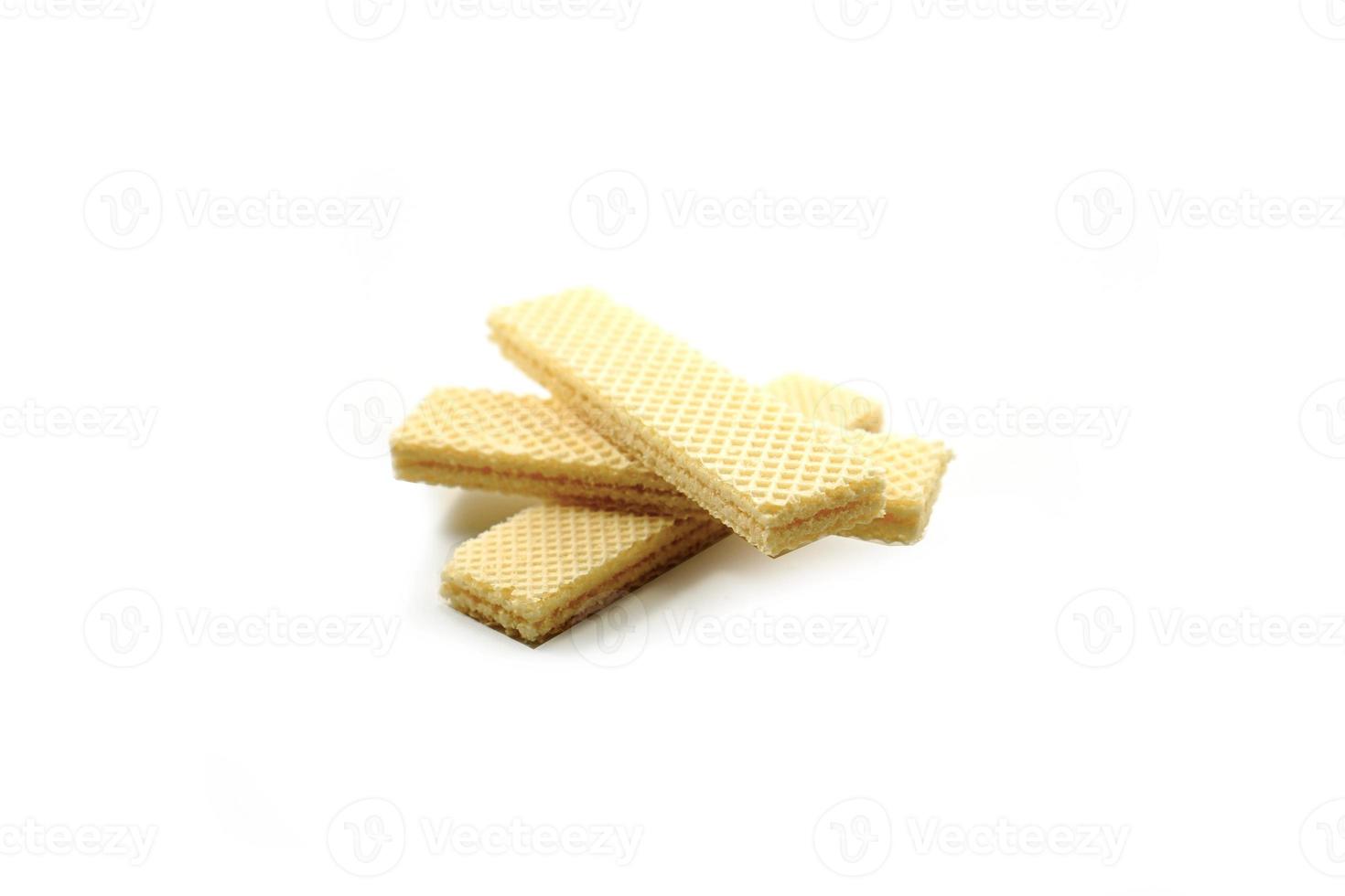 Delicious wafer sticks arranged in a pyramid shape isolated on a white photo