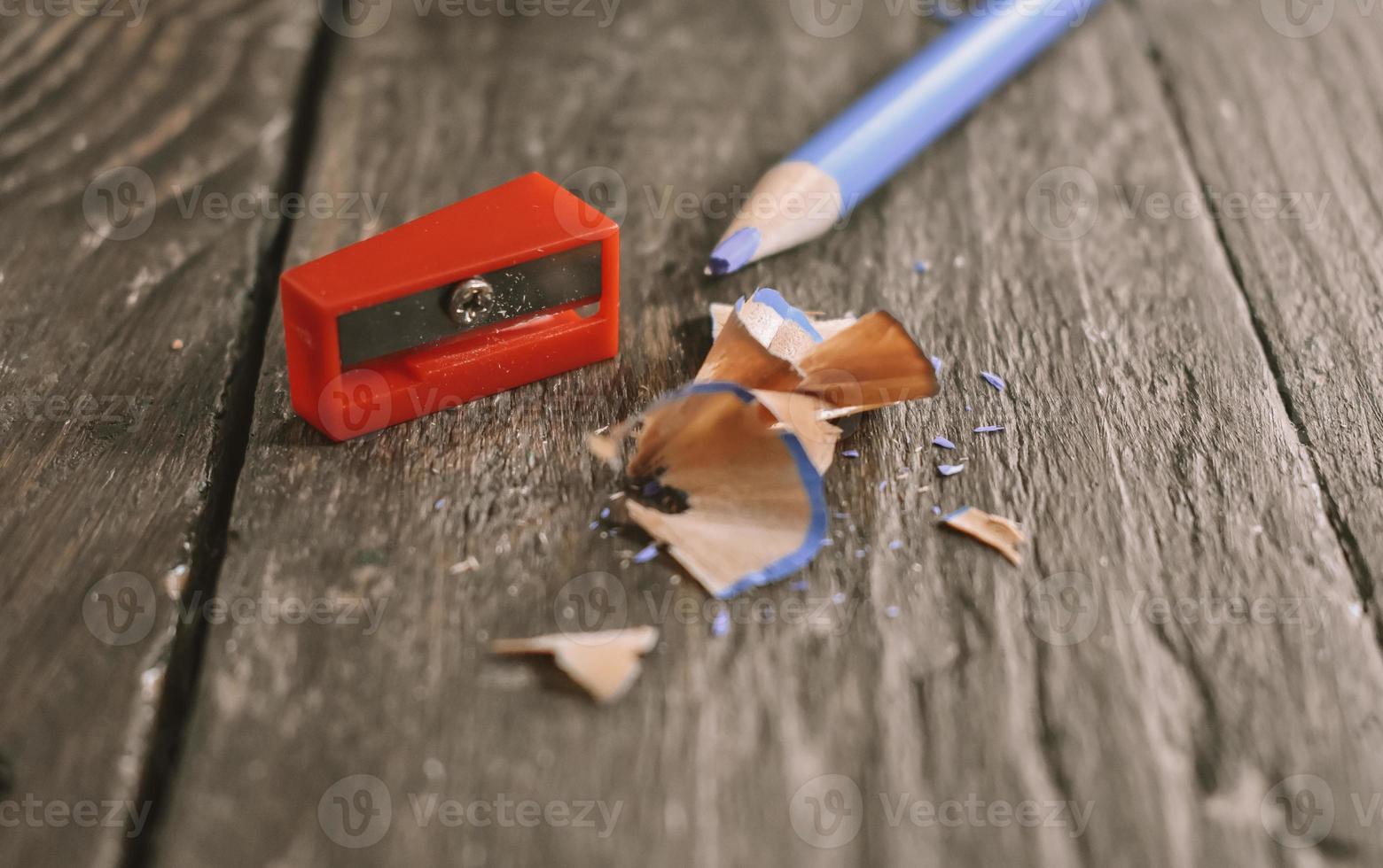 Pencil and sharpener on wooden table photo