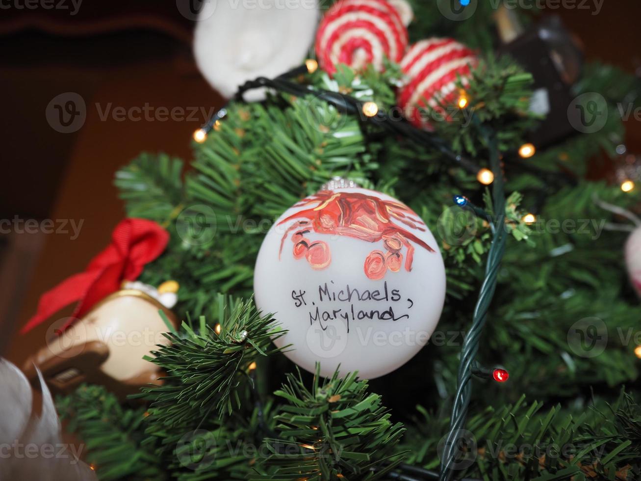 glass hand made christmas ball on xmas tree detail blur lights photo