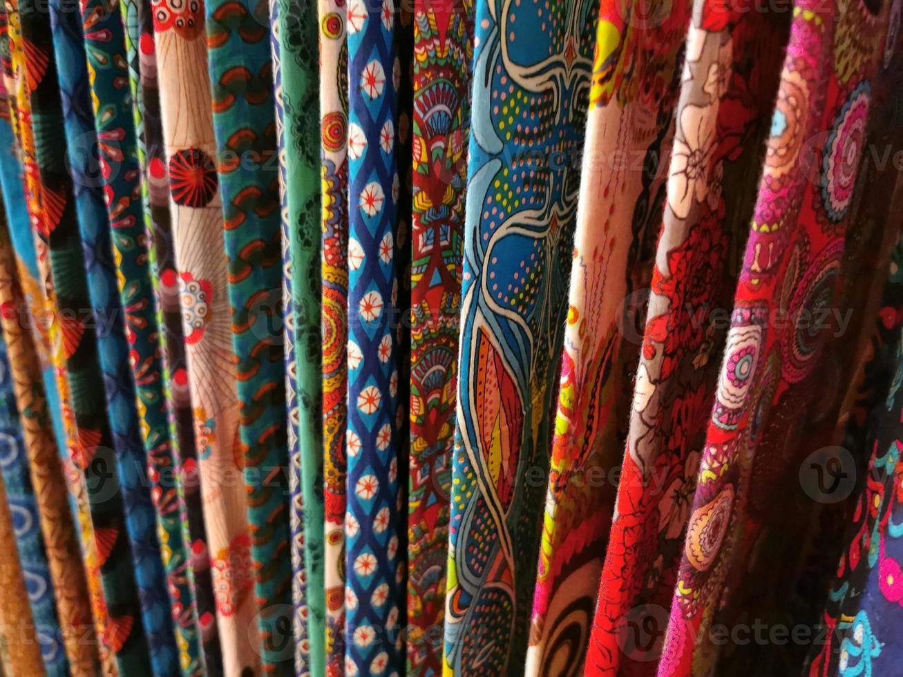many colors indian fabric clothes at the market photo