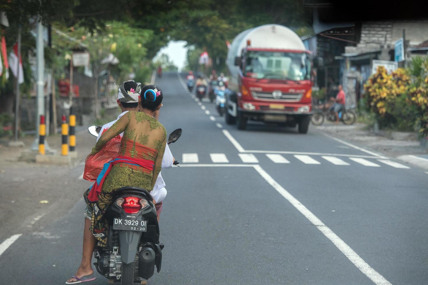 DENPASAR, BALI, INDONESIA - AUGUST 15, 2016 - Indonesia people biking photo
