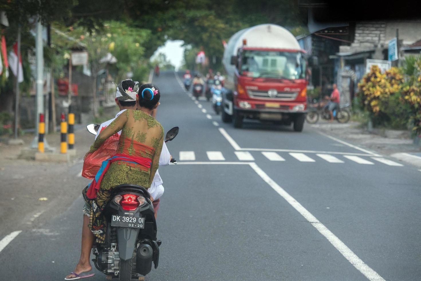 DENPASAR, BALI, INDONESIA - AUGUST 15, 2016 - Indonesia people biking photo