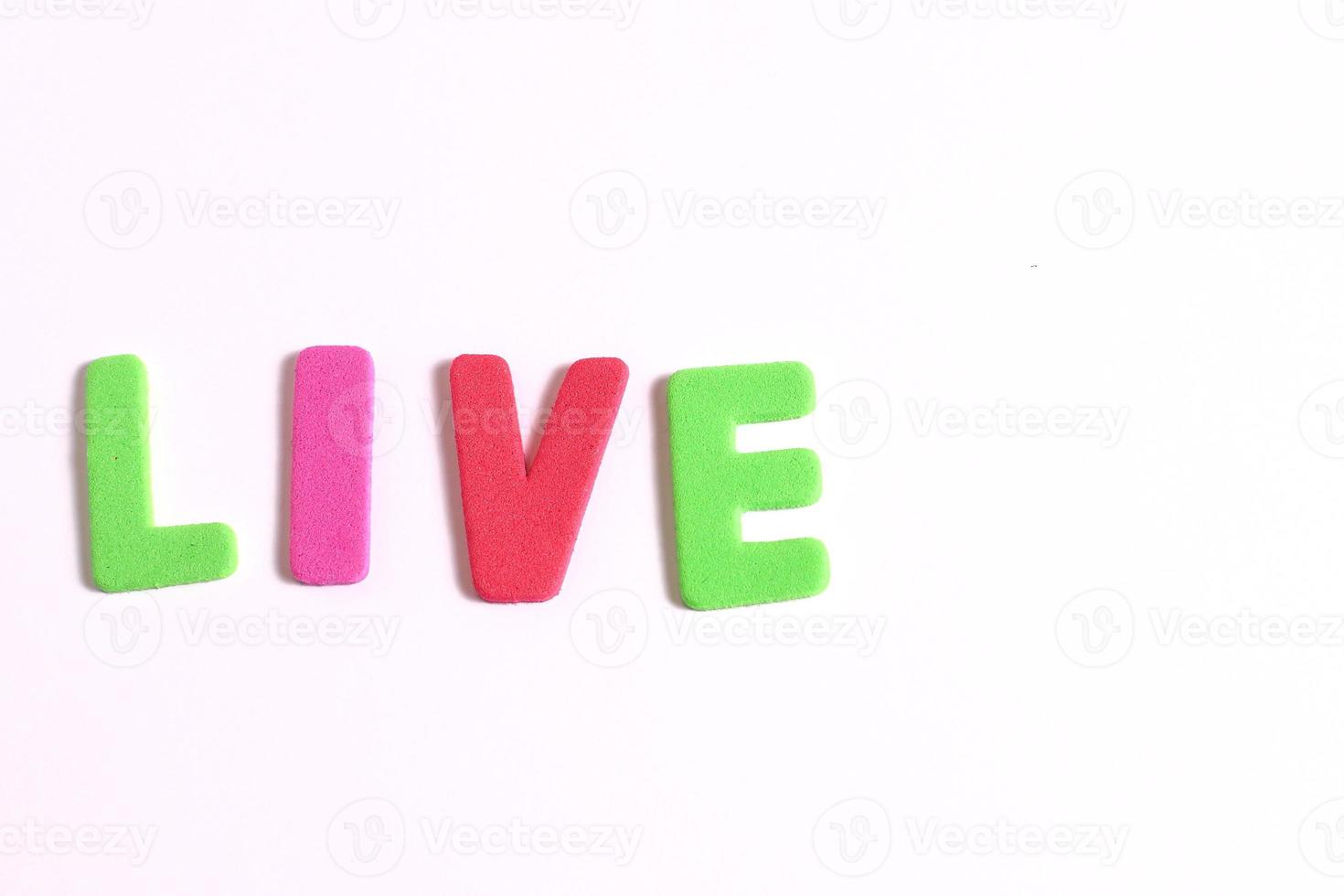 Lettering live word, colored letters on white photo